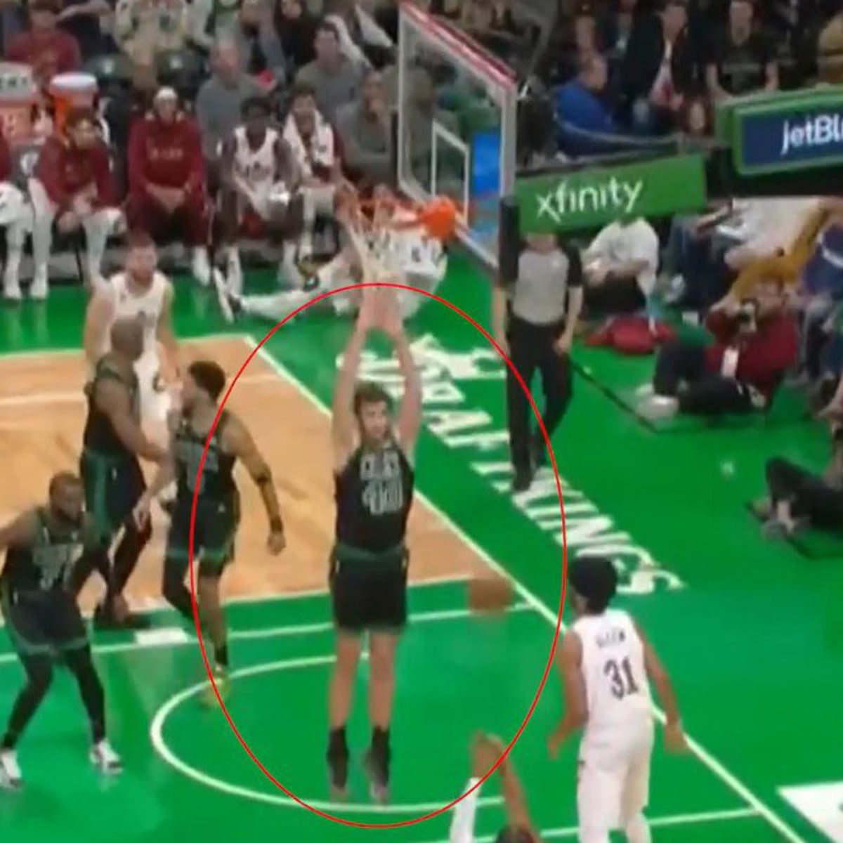 Luke Kornet of the Boston Celtics looks to pass against the New
