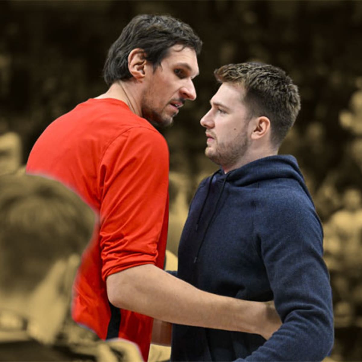 Boban Marjanovic and Luka Doncic of the Dallas Mavericks shake