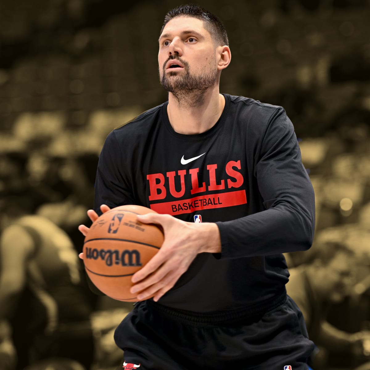 Chicago Bulls center Nikola Vucevic stands for his headshot during