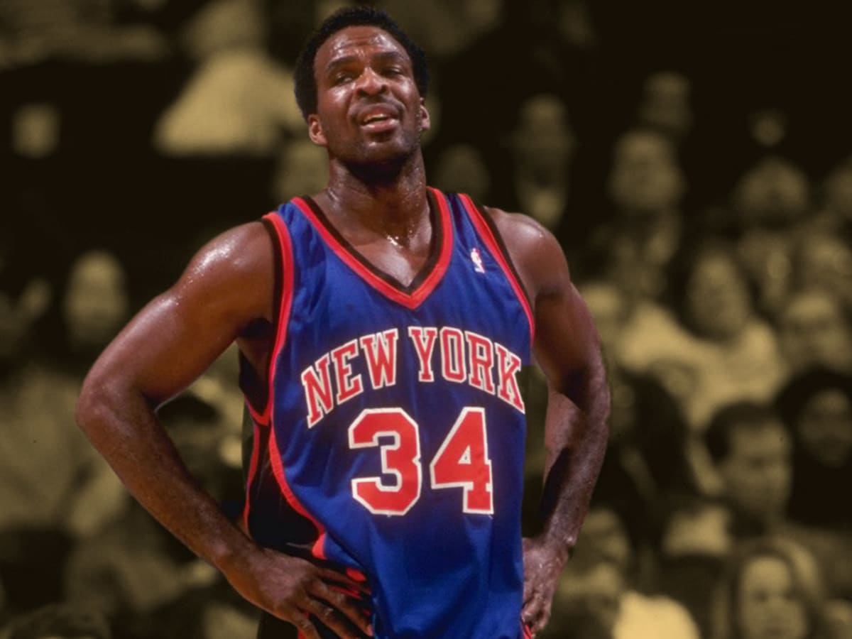 New York Knicks forward Charles Oakley slam dunks the ball after