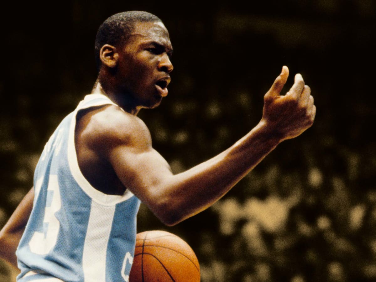 Michael Jordan hits head on the backboard after chase down block