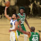 Golden State Warriors guard Stephen Curry shoots against Boston Celtics center Al Horford and center Robert Williams III