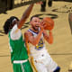 Golden State Warriors guard Stephen Curry shoots the ball against Boston Celtics center Robert Williams III and guard Derrick White