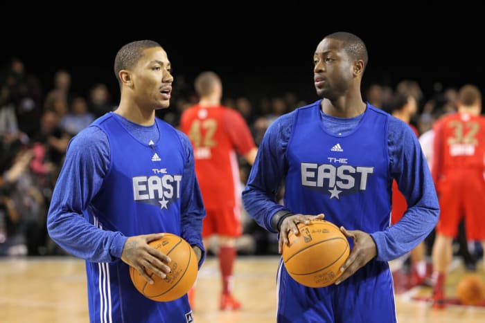 LOS ANGELES, CA - FEBRUARY 19: Derrick Rose #1 of the Chicago Bulls talks with Dwyane Wade #3 of the Miami Heat during the East & West All-Star Practice on center court at Jam Session presented by Adidas during NBA All Star Weekend at the Los Angeles Convention Center on February 19, 2011 in Los Angeles, California. NOTE TO USER: User expressly acknowledges and agrees that, by downloading and or using this photograph, User is consenting to the terms and conditions of the Getty Images License Agreement. Mandatory Copyright Notice: Copyright 2011 NBAE (Photo by Joe Murphy/NBAE via Getty Images)