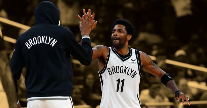 Kyrie Irving celebrating with Kevin Durant after his 60-point game against the Orlando Magic