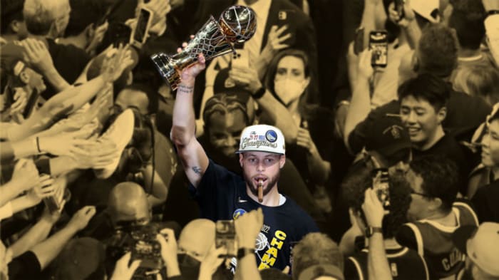 Golden State Warriors guard Stephen Curry holds the Most Valuable Player trophy after defeating the Boston Celtics in Game 6 of the 2022 NBA Finals at TD Garden