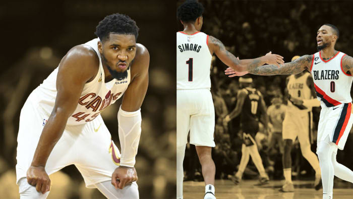 Cleveland Cavaliers guard Donovan Mitchell (45)/ Portland Trail Blazers guard Anfernee Simons (1) celebrates with guard Damian Lillard (0) after making a three-point shot