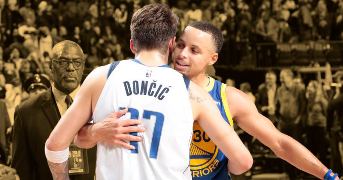Luka Doncic and Steph Curry embracing after a game