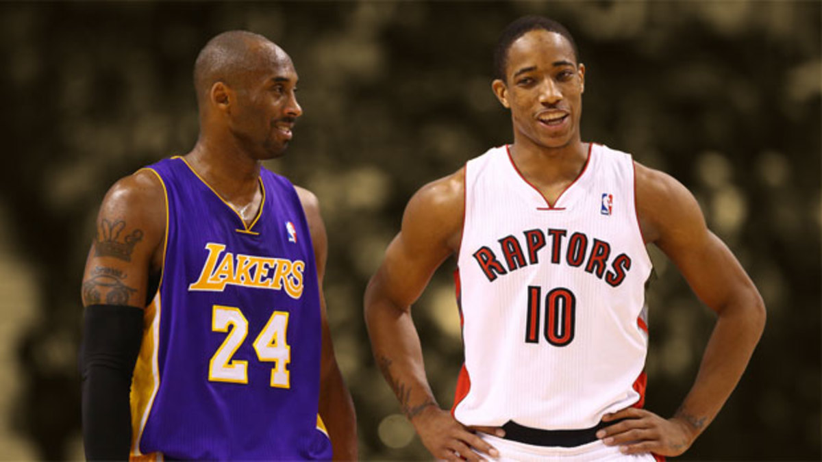 Los Angeles Lakers guard Kobe Bryant talks to Toronto Raptors forward DeMar DeRozan