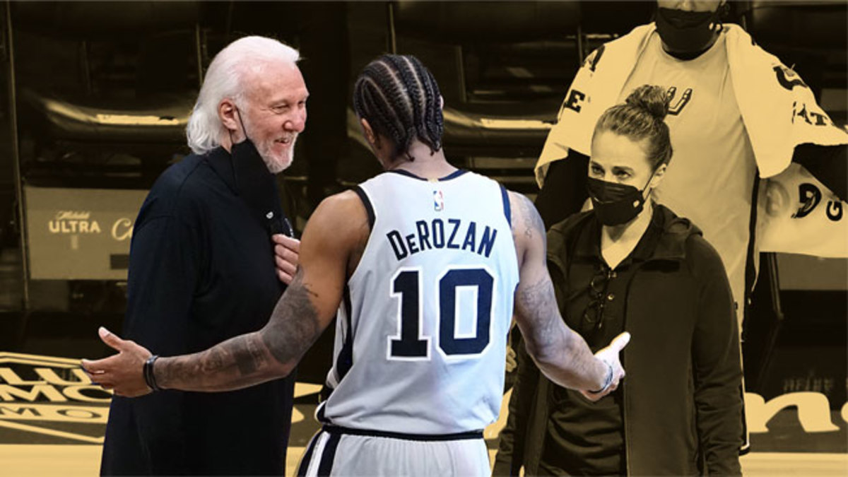 San Antonio Spurs head coach Gregg Popovich smiles with guard DeMar DeRozan