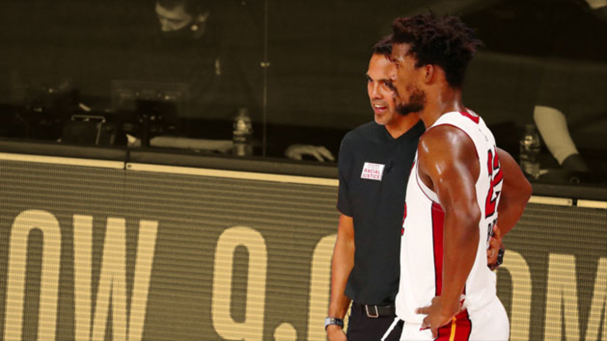 Miami Heat forward Jimmy Butler talks with head coach Erik Spoelstra