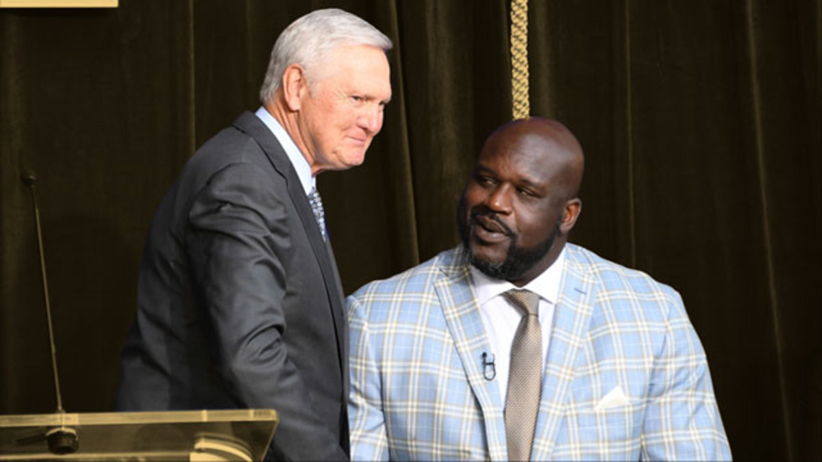 Jerry West shakes hands with Los Angeles Lakers former center Shaquille O'Neal