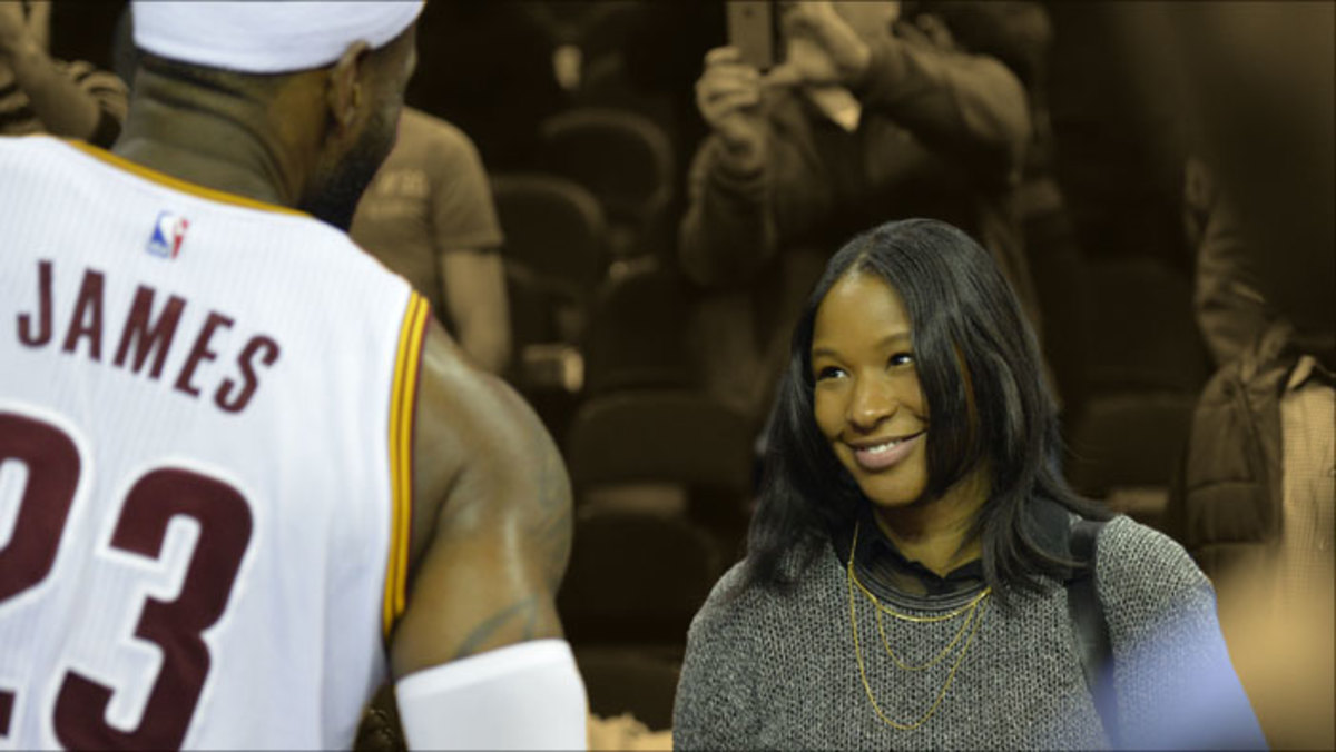 Cleveland Cavaliers forward LeBron James talks to his wife Savannah Brinson