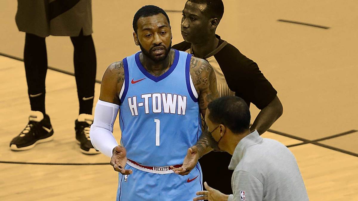 March 22, 2021; Houston Rockets guard John Wall speaks to head coach Stephen Silas at Toyota Center