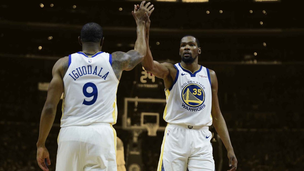 Golden State Warriors forward Kevin Durant (35) celebrates with guard Andre Iguodala (9)