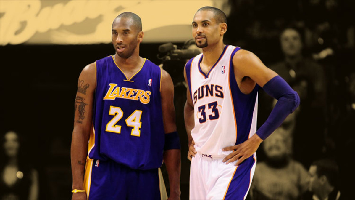 Los Angeles Lakers guard Kobe Bryant stands alongside Phoenix Suns forward Grant Hill
