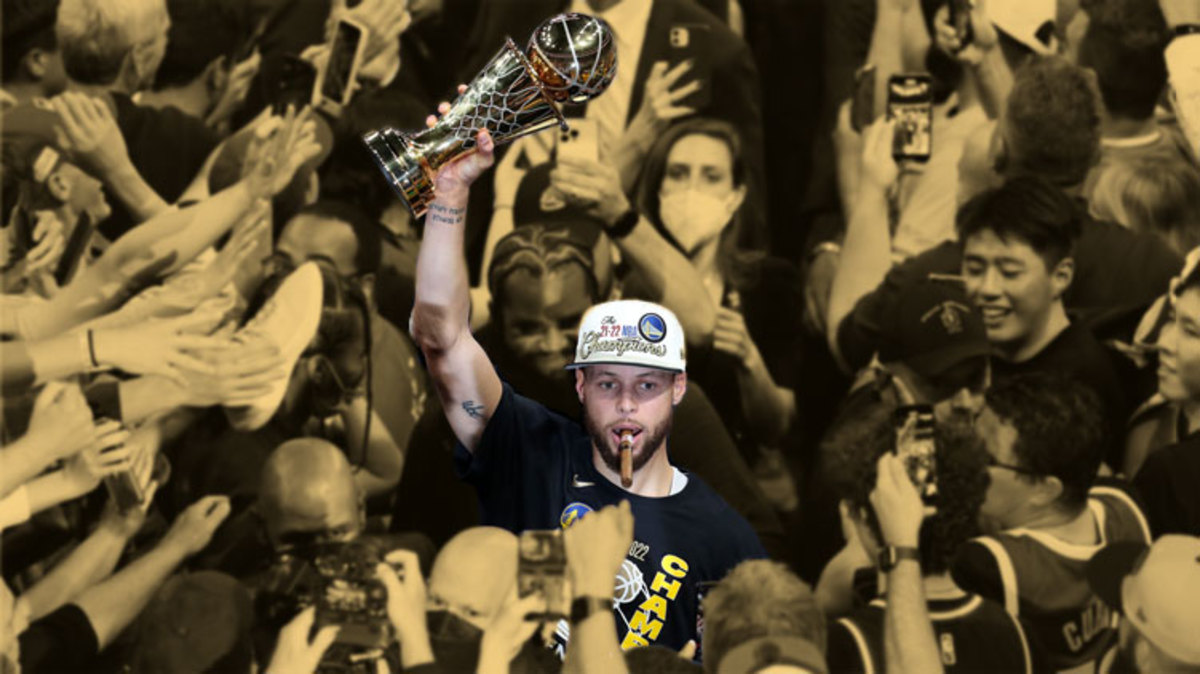 Golden State Warriors guard Stephen Curry holds up the Most Valuable Player Trophy after defeating the Boston Celtics in game six in the 2022 NBA Finals at the TD Garden