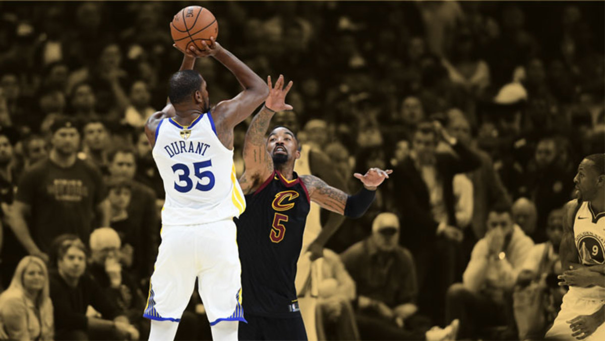 Golden State Warriors forward Kevin Durant shoots a three point basket over Cleveland Cavaliers guard JR Smith in the 2018 NBA Finals