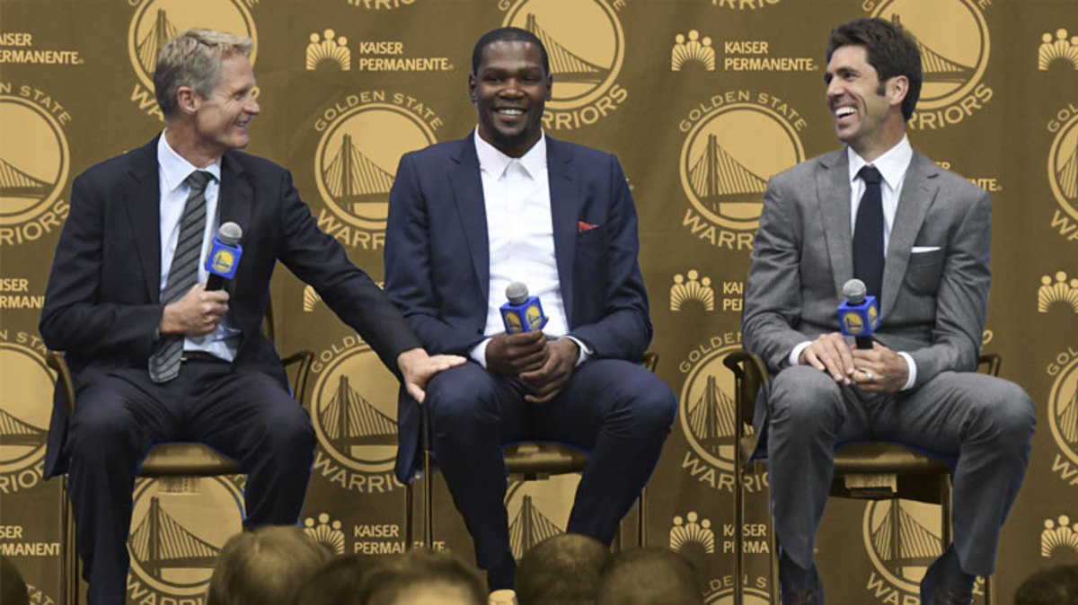Golden State Warriors head coach Steve Kerr, Kevin Durant, and general manager Bob Myers