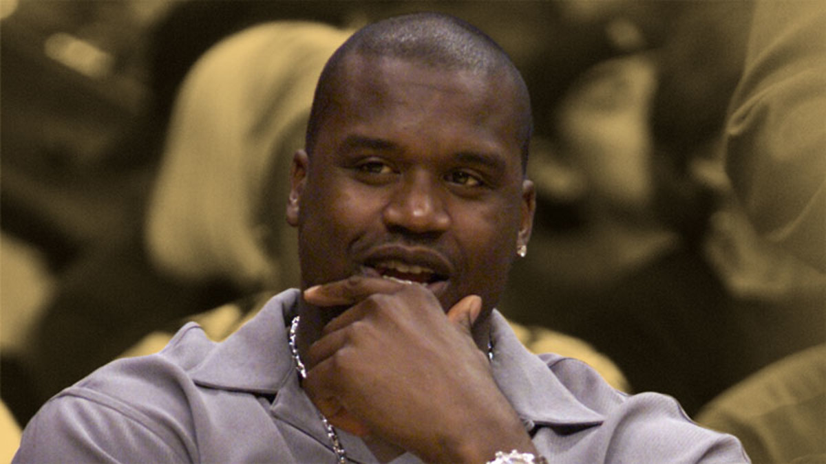 Shaquille O'Neal sits on the Laker bench