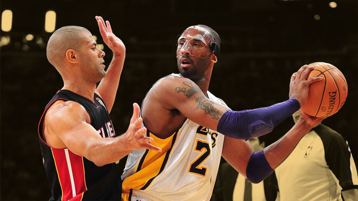 Los Angeles Lakers shooting guard Kobe Bryant controls the ball against the defense of Miami Heat small forward Shane Battier