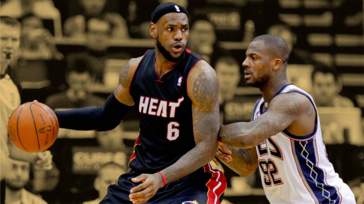 Miami Heat small forward LeBron James works the baseline against New Jersey Nets shooting guard DeShawn Stevenson