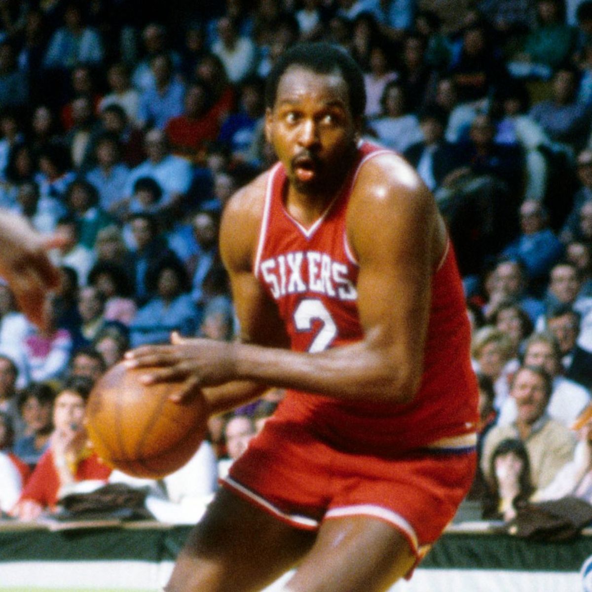 Moses Malone with a slash to the basket