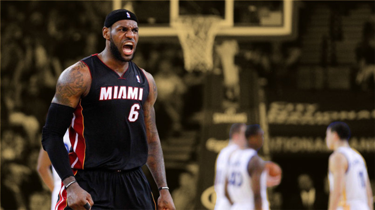 Miami Heat forward LeBron James reacts after recording an assist against the Golden State Warriors