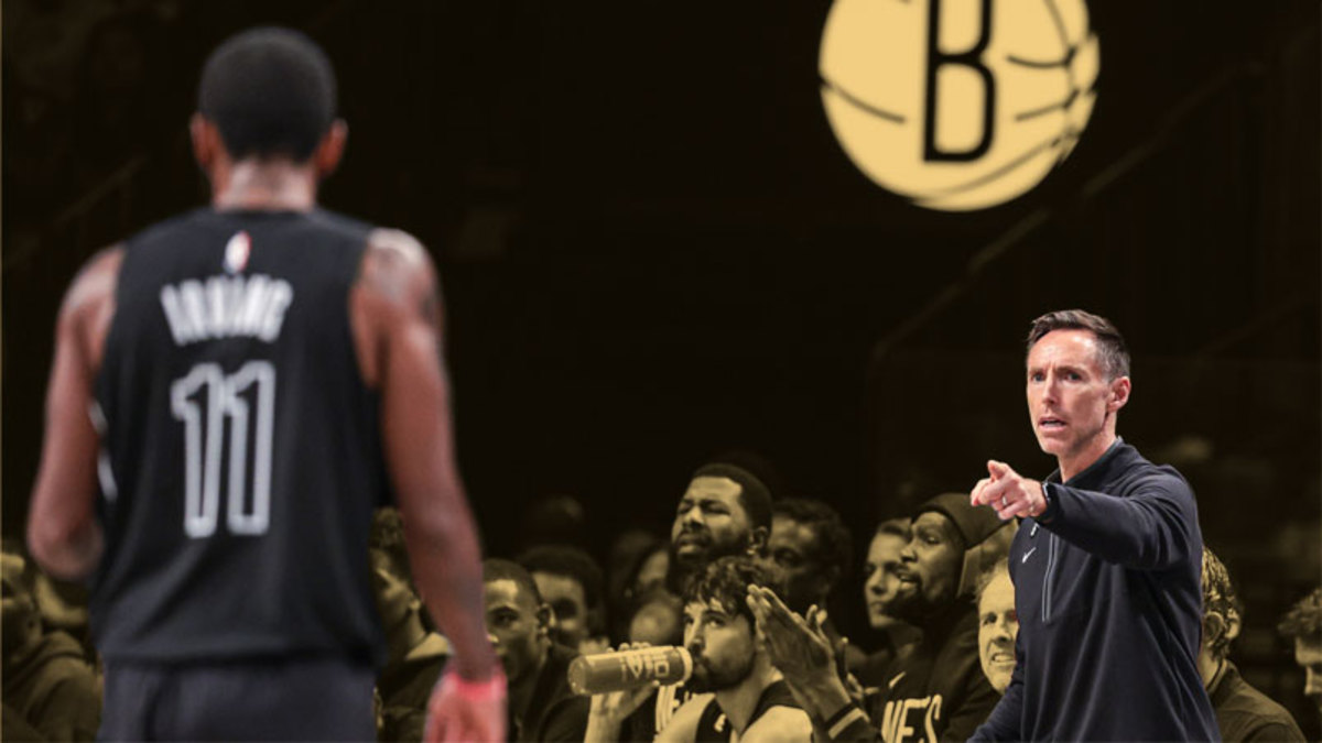 Brooklyn Nets head coach Steve Nash points towards guard Kyrie Irving