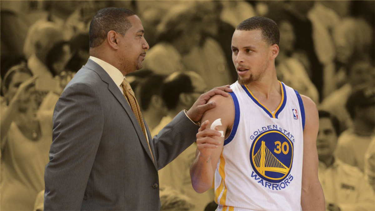 Golden State Warriors head coach Mark Jackson talks to guard Stephen Curry