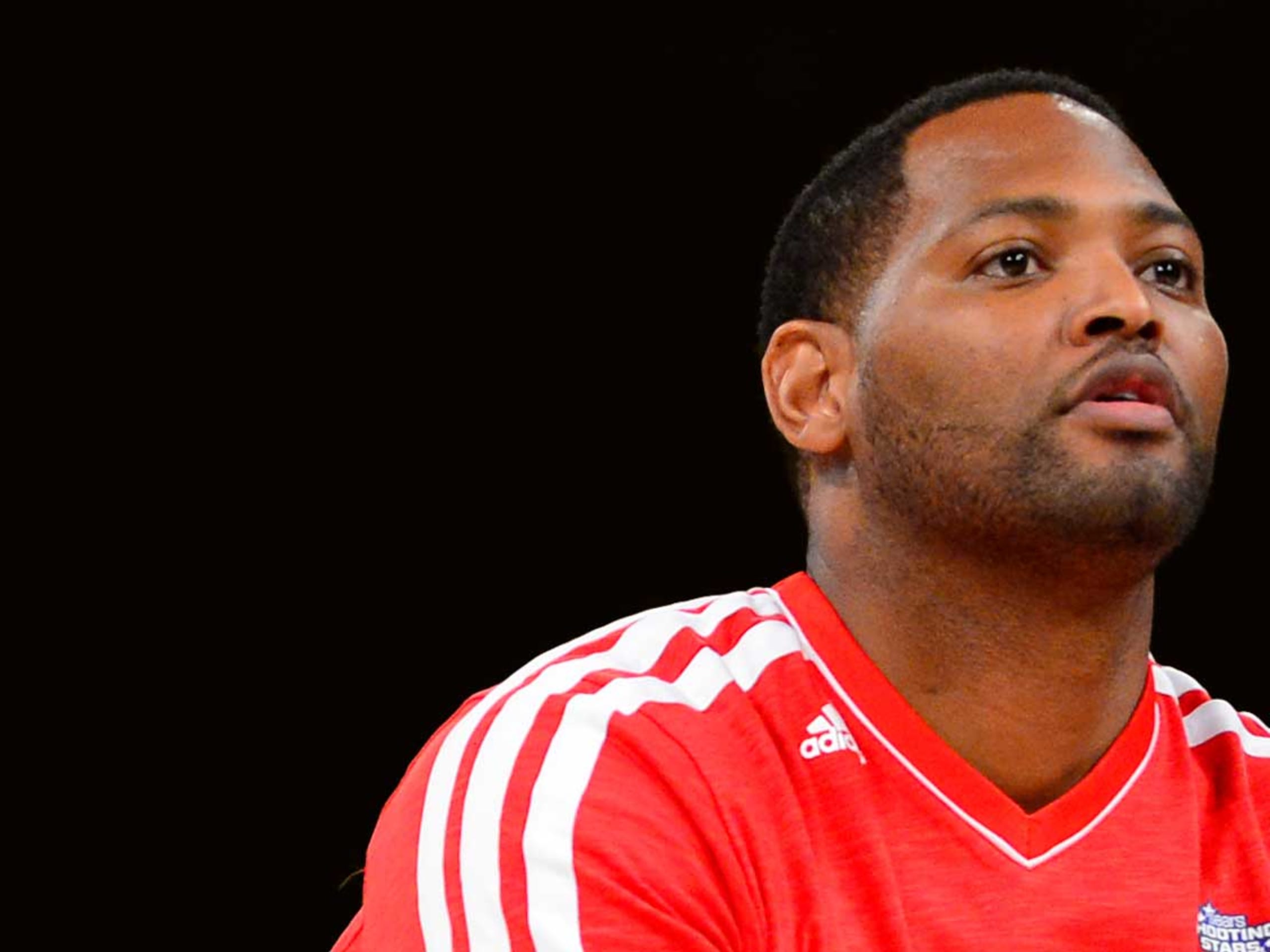 NBA former player Robert Horry shoots during the 2013 NBA All-Star shooting stars competition at the Toyota Center.