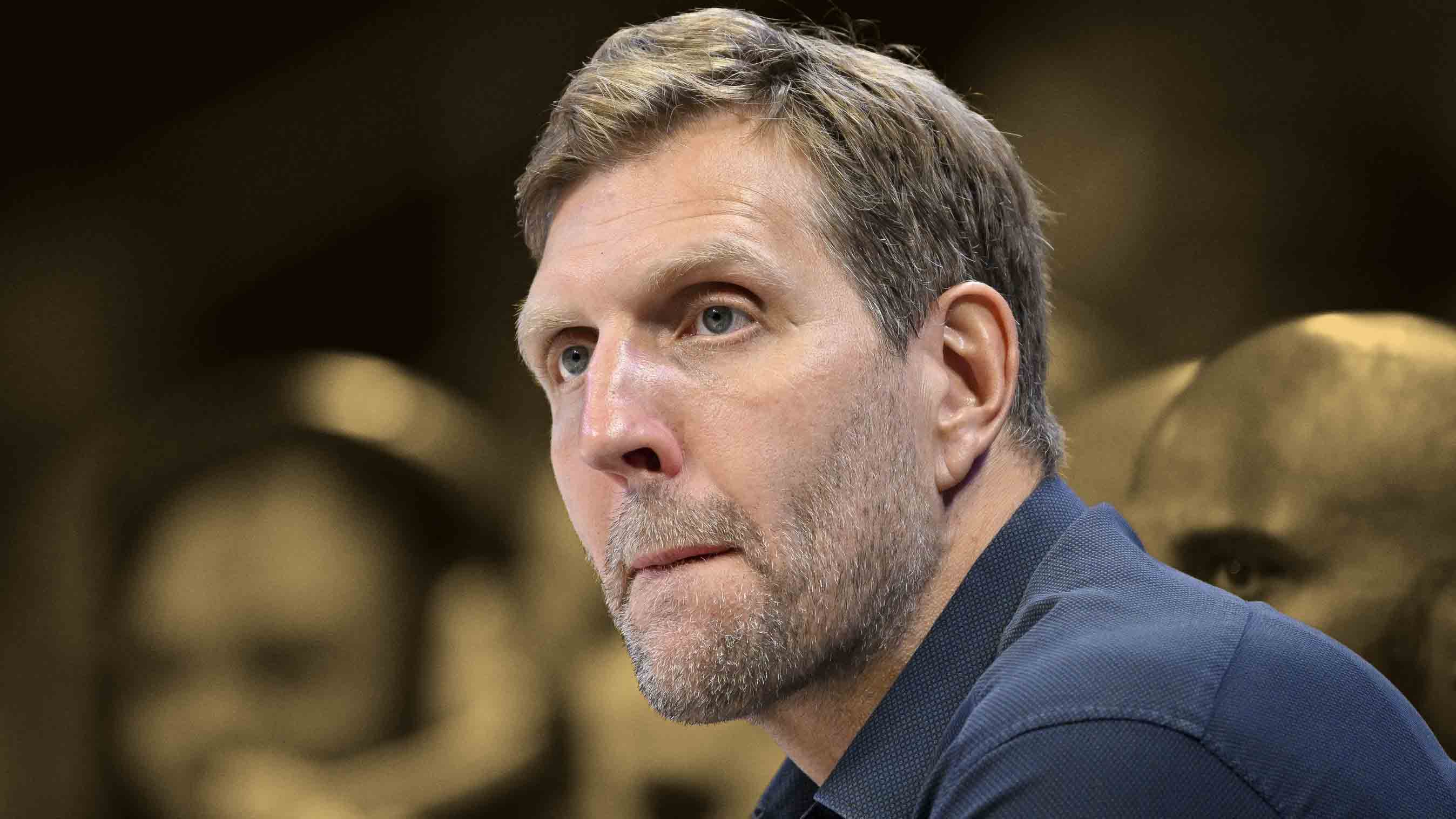 Dirk Nowitzki and Taylor Rooks re-enact Ja Morant's grenade celebration  before the Mavs game., image size:2696x1517