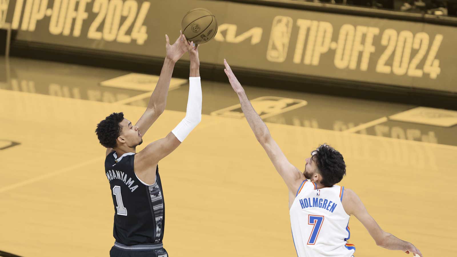 San Antonio Spurs center Victor Wembanyama (1) shoots as Oklahoma City Thunder forward Chet Holmgren (7) defends during the first quarter at Paycom Center. 